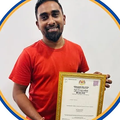 A member of the Sunfly Manufacturing team with a framed certificate