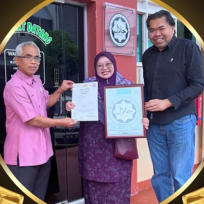 The YCM Food Industry team holding a halal certificate